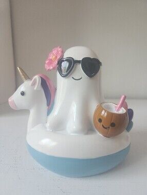 White Ghost Unicorn Float Figurine with Pink Accents Holding A Coconut
